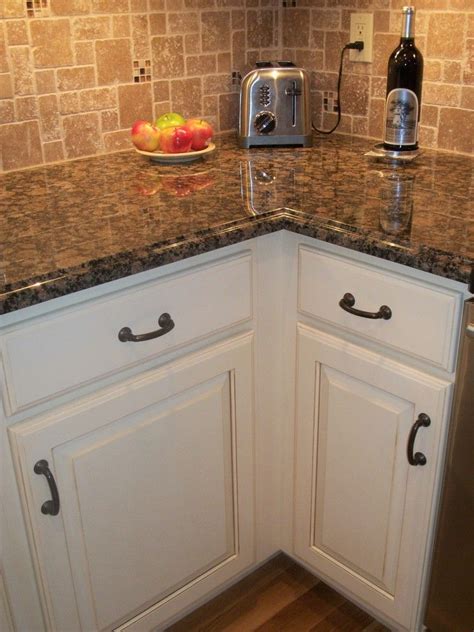 Our transitional kitchen reveal white granite countertops. Antique White cabinet, black / oil rubbed bronze hardware ...