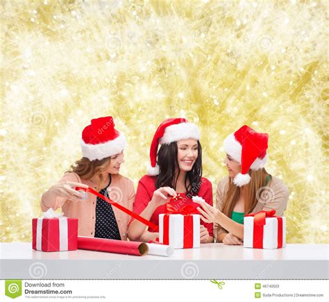 Smiling Women In Santa Helper Hats Packing Ts Stock Image Image Of