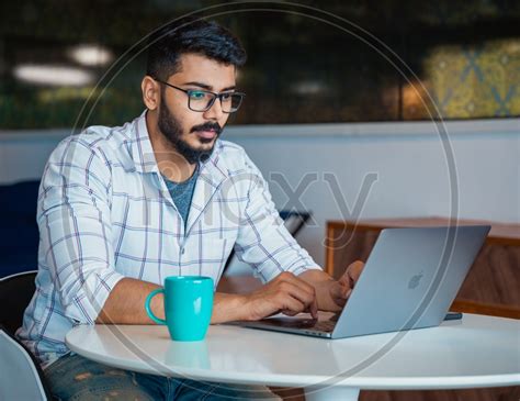 Image Of Focused Serious Working Indian Professional It Employee Young
