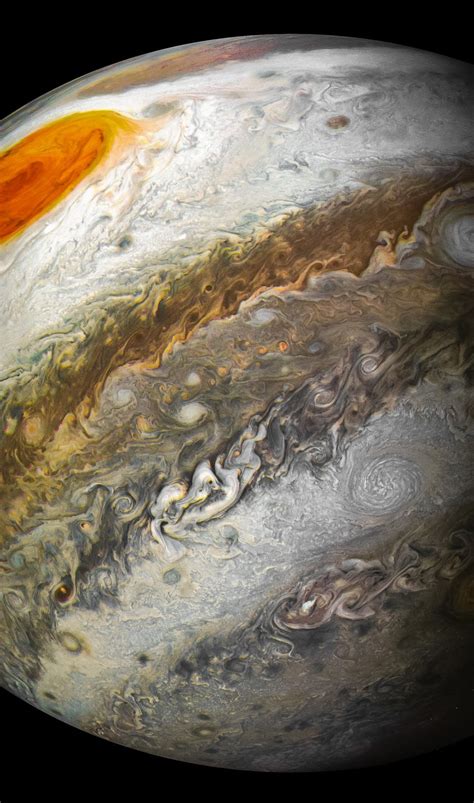 jupiter s great red spot captured by juno in stunning nasa photos