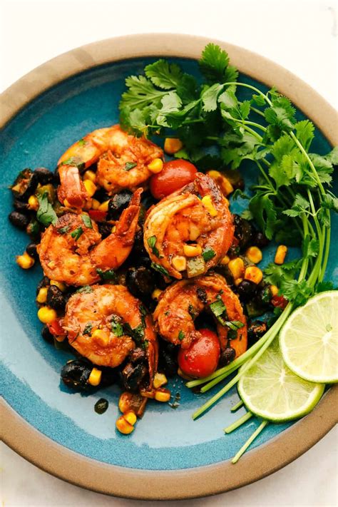 Coat shrimp with a sweet, curry chutney before tossing with sliced zucchini, hearty lentils and fresh cilantro. Mexican shrimp skillet served on a plate. in 2020 ...
