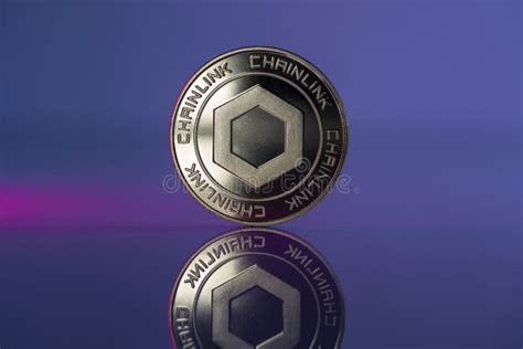 Chainlink Link Crypto Coin Placed On Reflective Surface And Lit With Blue And Purple Lights