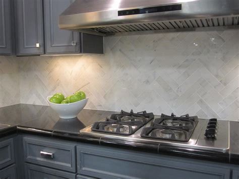 I learned so much installing this tile! Marble Herringbone Backsplash - Contemporary - kitchen