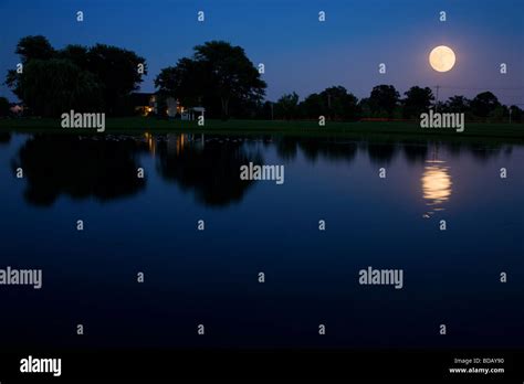 Moonrise Over Lake Stock Photo Alamy