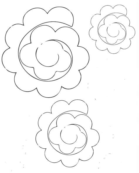 Three Paper Flowers Are Shown In Black And White