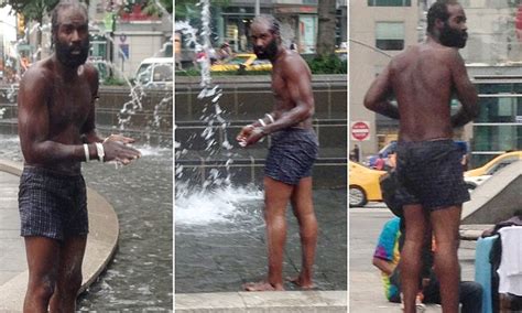 Homeless Man Bathes With Bar Of Soap In Ny S Columbus Circle Fountain