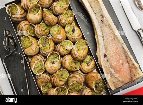 Bourgogne Escargots Snails With Herbs Butter With Marrow On Plate Of