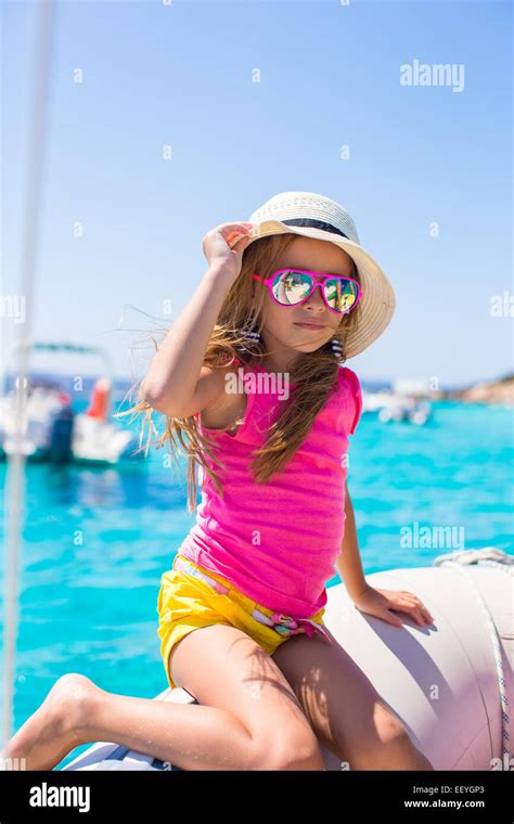 Cute Little Girl Enjoying Sailing On Boat In The Sea Stock Photo