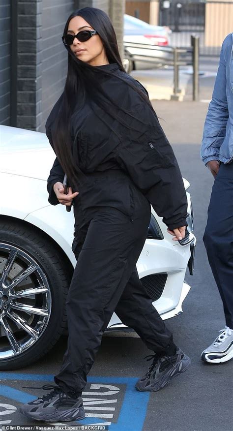 Kim Kardashian Dons Baggy Black Jumpsuit To Accompany Kanye West Yeezy Outfit Kim Kardashian