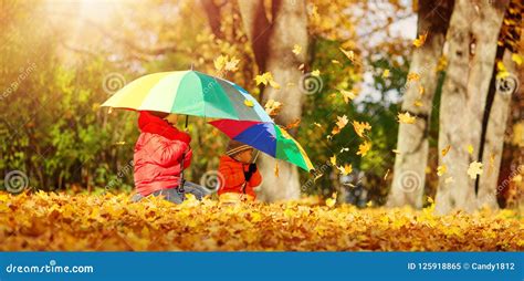 Children With Umbrellas In Beautiful Autumnal Day Stock Image Image