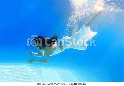 Woman Wearing A White Dress Underwater In Swimming Pool Canstock