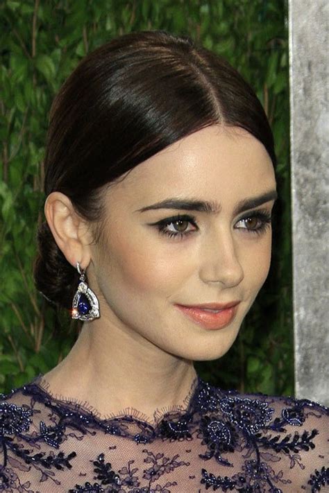 Lily Collins Straight Dark Brown Bun Updo Hairstyle Steal Her Style