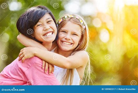 Asian And Caucasian Girl Hug Each Other Stock Image Image Of Smile