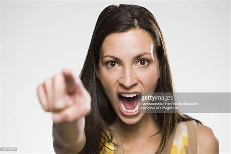 Portrait Of Woman Yelling And Pointing Photo Getty Images