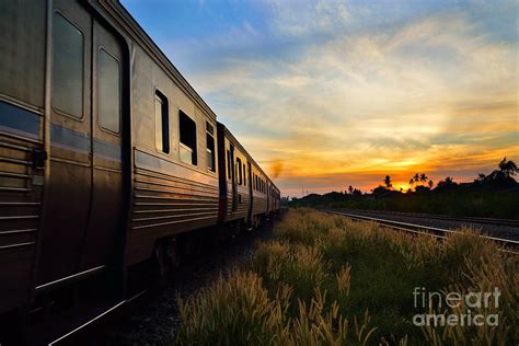 Train Passing By Over Rural Railway In The Morning Or At Dawn Wi