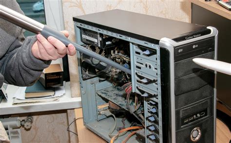 Cleaning The System Unit Of A Desktop Computer From Dust Using A Vacuum
