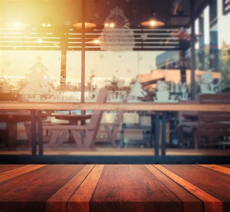 Empty Brown Wooden Table Surface And Coffee Shop Blur Background With