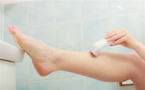 Woman Shaving Legs With Depilator In Bathroom Stock Image Image Of Girl Shaving 74739303
