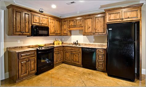 Hickory and alder are used often now, murphy says, though alder has been the most popular wood cabinet material for 15 years or so. dark-knotty-alder-kitchen-cabinets - We Organize-U