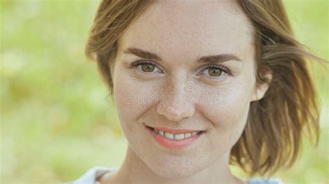 Face Close Up Of A Smiling Young Girl With Freckles Stock Image