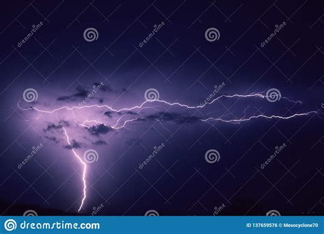 A Strong Flash Of Lightning In The Sky While A Strong Storm Hits The