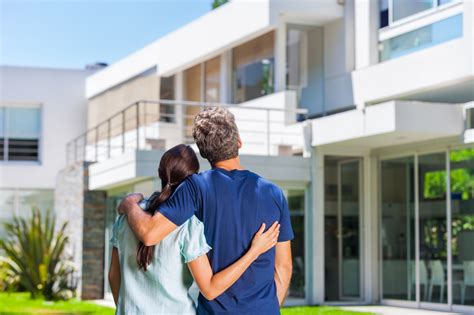 Couple Looking At New Home Property Title Escrow Llc