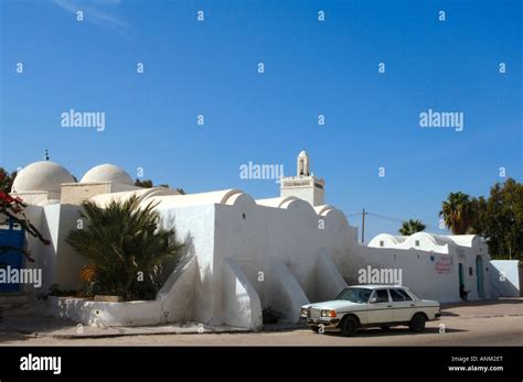 A White Mercedes Parked Outside A Jerban Mosque In Houmt Souk Stock Photo Alamy