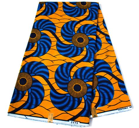 Two Pieces Of Cloth With Blue And Orange Designs On Them One Is Folded Over The Other