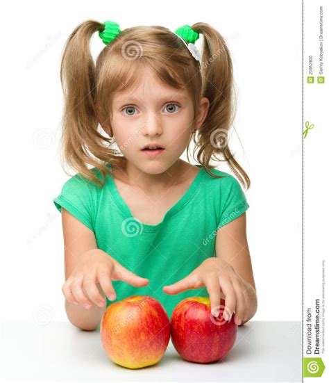 Portrait Of A Little Girl With Apple Stock Photo Image