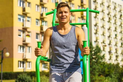 Man Doing Sit Ups In Outdoor Gym Stock Photo Image Of Active Adult