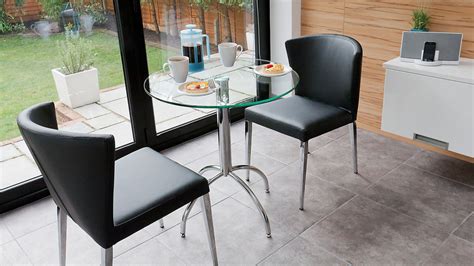 If your kitchen is awkwardly shaped, this small dining table can be your safe bet. Modern Round Glass Kitchen Table | Trendy Chrome Legs | Seats 2 People