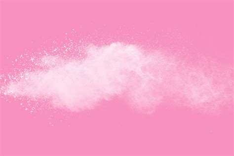 Premium Photo White Powder Explosion On Pink Background