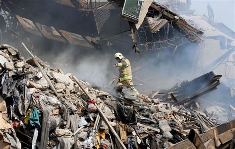 Many Iran Firefighters Feared Trapped In Building Collapse