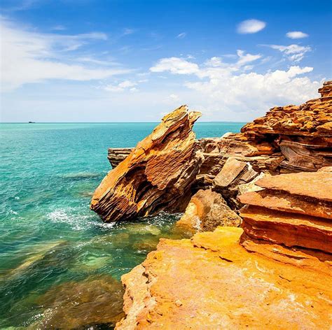 Towering Cliffs And Colorful Reefs Mesmerize You With Beauty Of