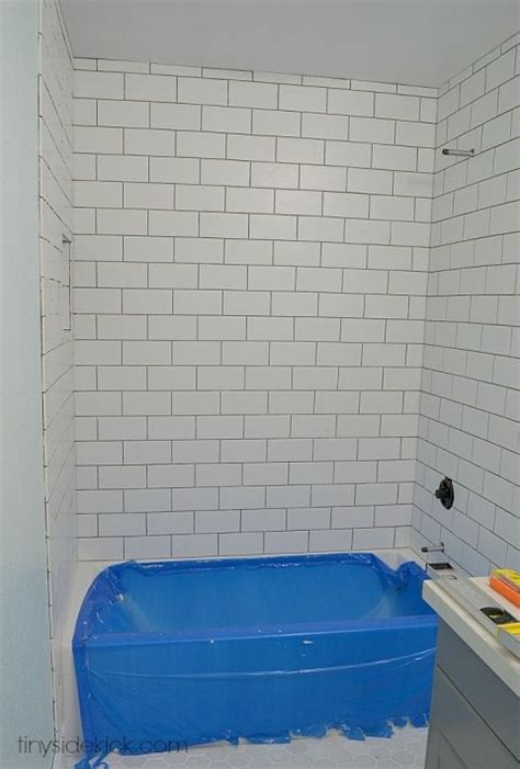 If you have tile or drywall above your fiberglass surround remove it with a hammer. How to Tile a Tub Surround | Tile tub surround, Bathtub ...