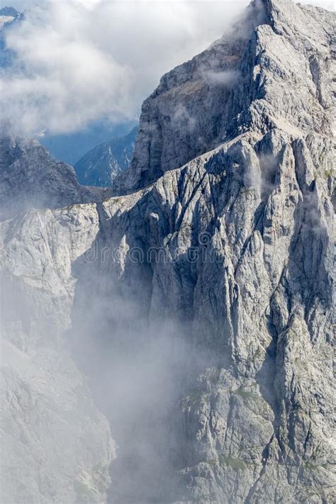 The Jalovec Mountain Ridge In Clouds Part Of Slovenia S Julian Alps