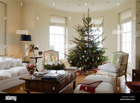 Christmas Tree Decorated With Baubles In Regency Living Room With