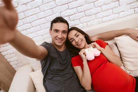 Premium Photo A Husband And A Pregnant Wife Make Selfie