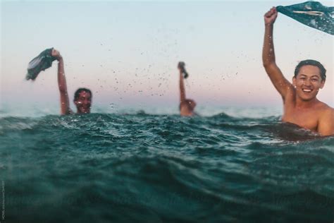 Three Friends Skinny Dip In The Maryland Ocean By Stocksy Contributor