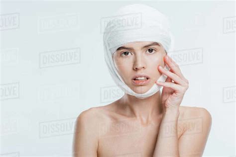 Nude Woman With Bandages On Head After Plastic Surgery Isolated On