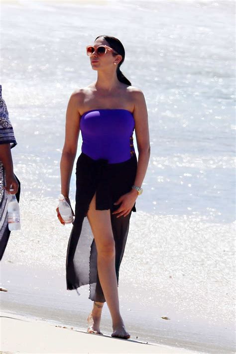 lauren silverman wears a purple swimsuit on her morning stroll along