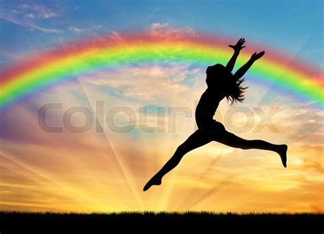 Happy Woman Jumping Near Rainbow Stock Image Colourbox