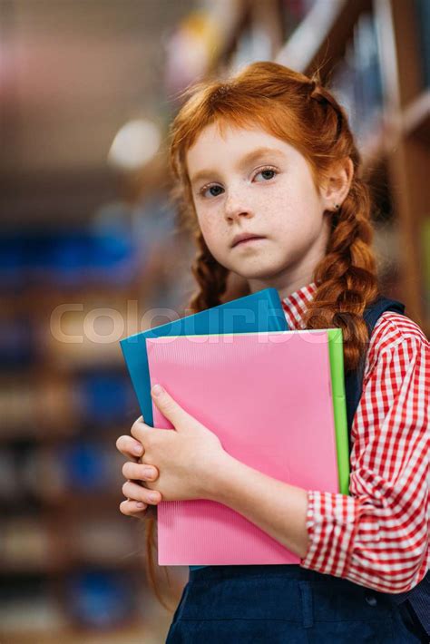 Redhead Schoolgirl In Library Stock Image Colourbox