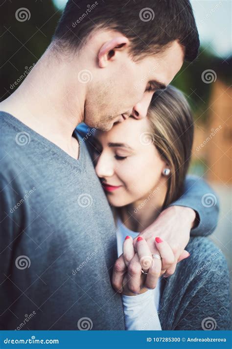 Happy Young Couple In Love On A Date Hugging Loving Couple Romance