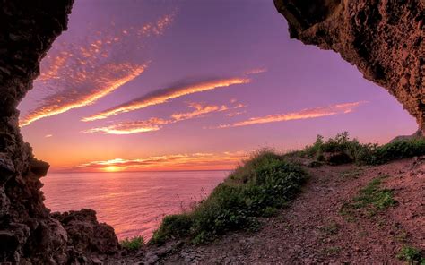 View Of Sunset Through Beach Cave Hd Wallpaper Background Image
