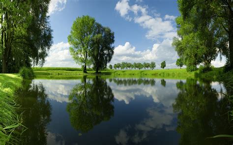 Beautiful Green Nature Reflecting In The Mirror Of The Lake Wallpaper Nature Wallpapers 48703