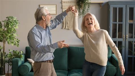Joyful Active Old Retired Romantic Couple Dancing In Living Room Sunjoint Development