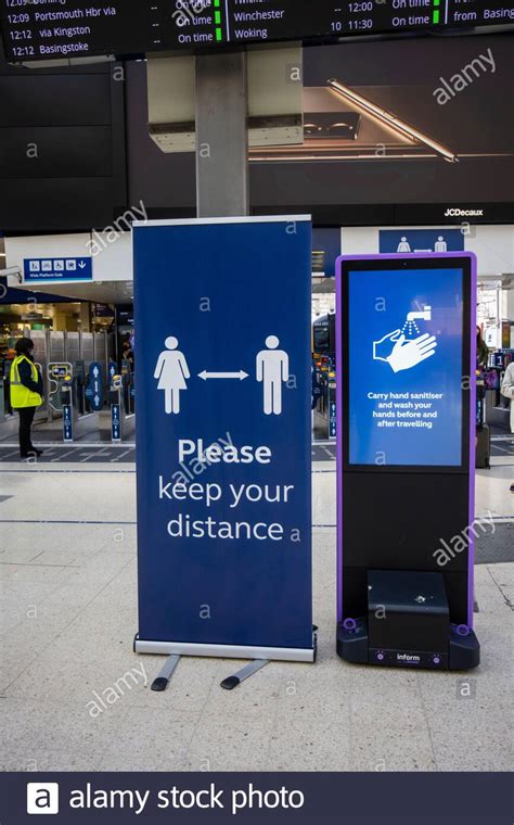 notice on the concourse of waterloo station london remiding people to keep their distance and