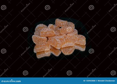 Sugar Covered Orange Shaped Candy On Black Background Stock Photo