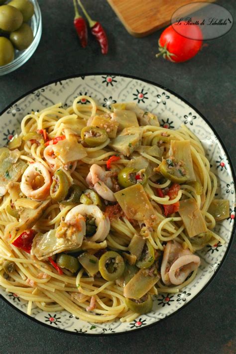 Procedimento ricetta pasta carciofi e prosciutto. Pasta con calamari, olive e carciofi | Le Ricette di Libellula